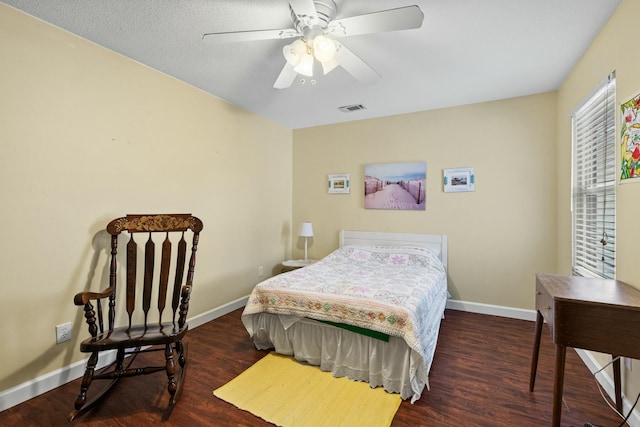 bedroom featuring dark hardwood / wood-style flooring and ceiling fan