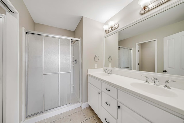 bathroom with vanity, tile patterned floors, and walk in shower