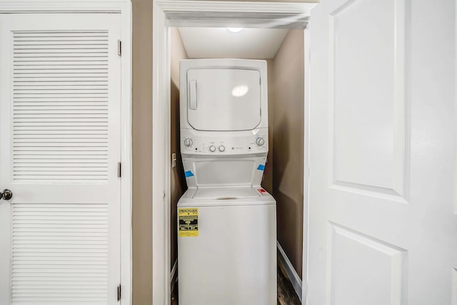 laundry room with stacked washer and clothes dryer