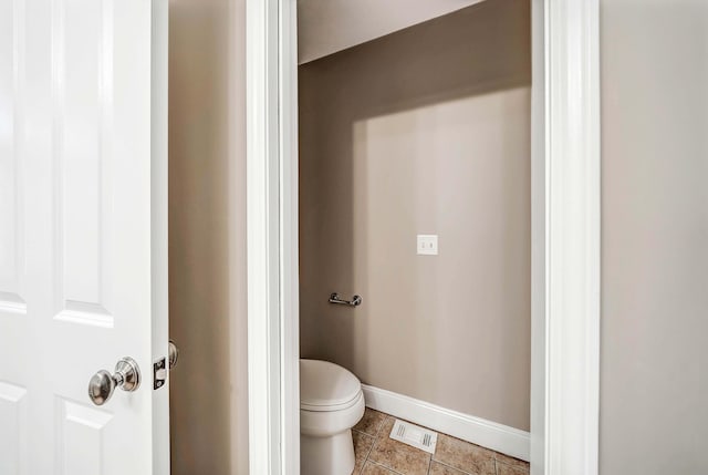bathroom featuring tile patterned floors and toilet