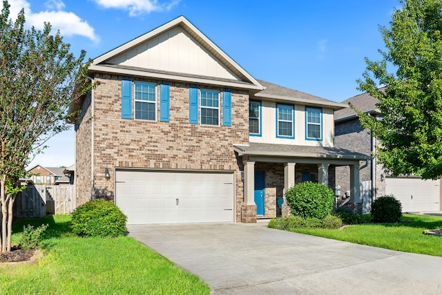 craftsman inspired home featuring a garage and a front lawn