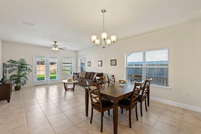 1729 Waterford Sound Blvd, Gulf Breeze, FL 32563 - tiled dining area with a healthy amount of sunlight and ceiling fan with notable chandelier