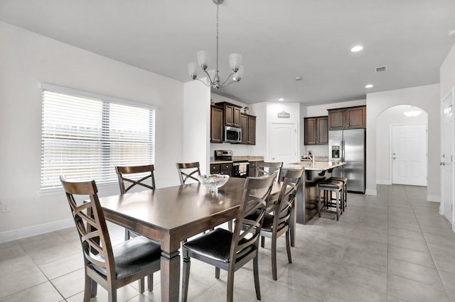 1729 Waterford Sound Blvd, Gulf Breeze, FL 32563 - dining area with an inviting chandelier, light tile patterned floors, and sink