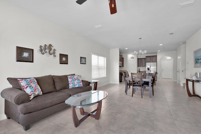 1729 Waterford Sound Blvd, Gulf Breeze, FL 32563 - tiled living room with ceiling fan with notable chandelier