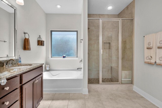 1729 Waterford Sound Blvd, Gulf Breeze, FL 32563 - bathroom featuring tile patterned floors, vanity, and separate shower and tub