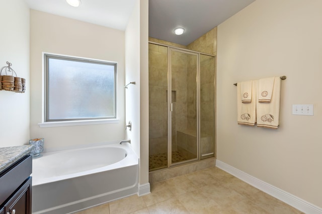 1729 Waterford Sound Blvd, Gulf Breeze, FL 32563 - bathroom with tile patterned floors, vanity, and separate shower and tub