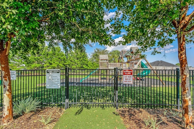 1729 Waterford Sound Blvd, Gulf Breeze, FL 32563 - view of gate featuring a lawn