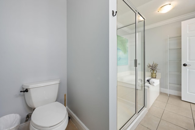 bathroom featuring toilet, tile patterned floors, crown molding, and a shower with shower door