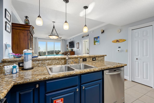 kitchen featuring blue cabinets, dishwasher, hanging light fixtures, and sink