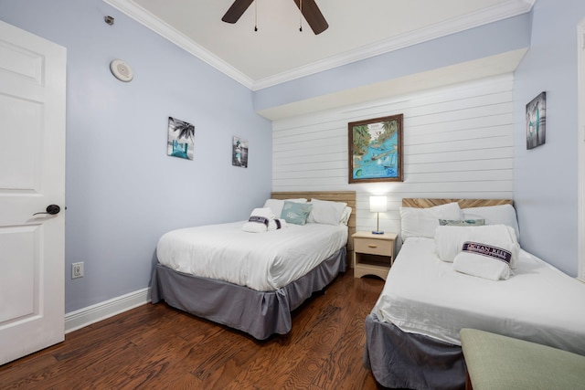 bedroom featuring crown molding, dark wood-type flooring, and ceiling fan