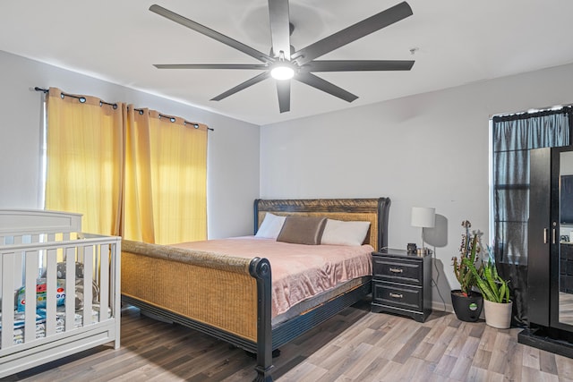 bedroom featuring ceiling fan and wood finished floors