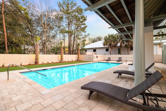 view of swimming pool with a patio