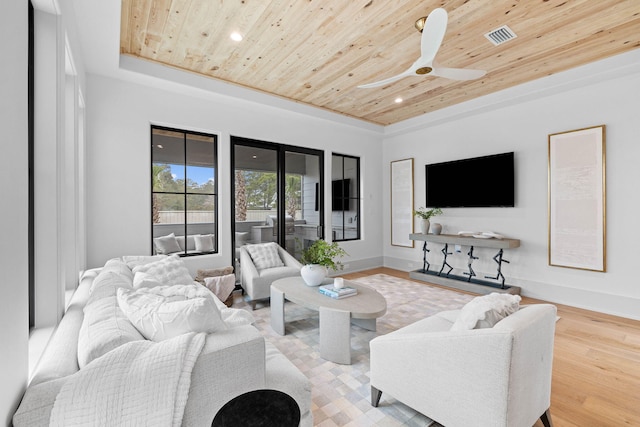 living room with ceiling fan, light hardwood / wood-style floors, wood ceiling, and a tray ceiling