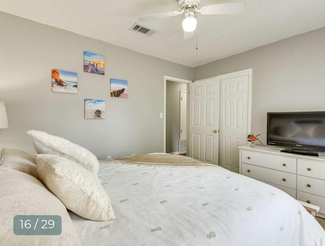 bedroom with ceiling fan and a closet