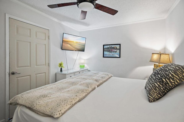 bedroom with crown molding, ceiling fan, and a textured ceiling