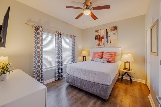 bedroom featuring ceiling fan and dark hardwood / wood-style floors