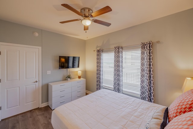 bedroom featuring ceiling fan and wood-type flooring