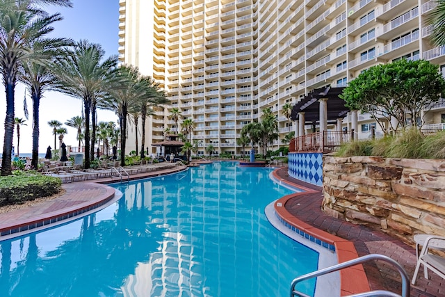 view of swimming pool featuring a pergola