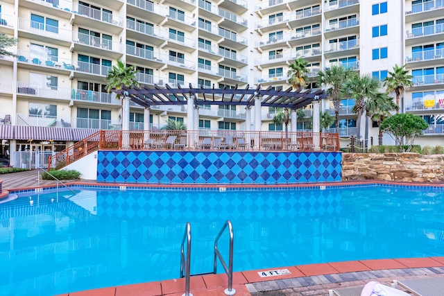 view of swimming pool featuring a pergola