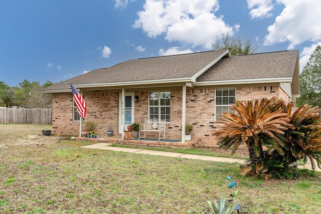 single story home featuring a front yard