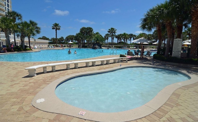 community pool featuring a patio