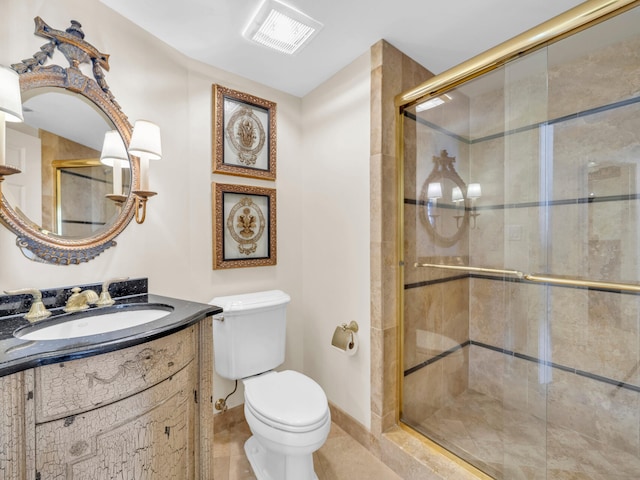 full bathroom with toilet, vanity, a shower stall, and visible vents