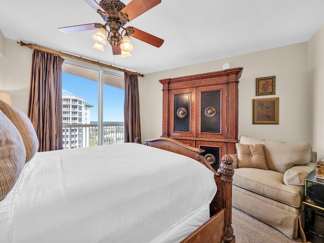 bedroom featuring access to outside, carpet floors, and a ceiling fan