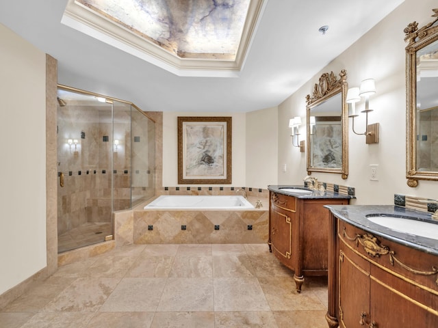 full bath with a garden tub, a raised ceiling, a sink, and a shower stall