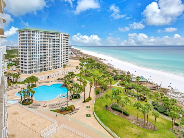 birds eye view of property with a water view and a view of the beach