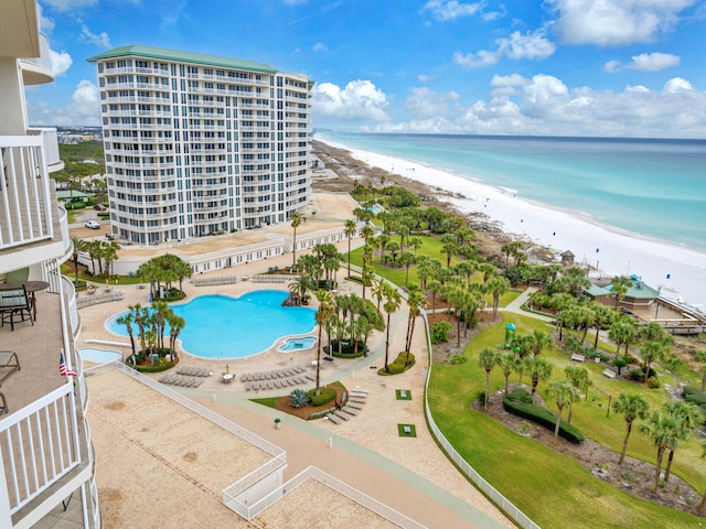 drone / aerial view with a beach view and a water view