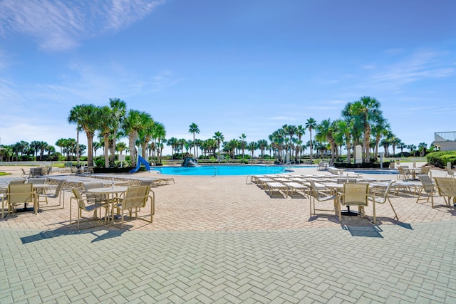 community pool featuring a patio area