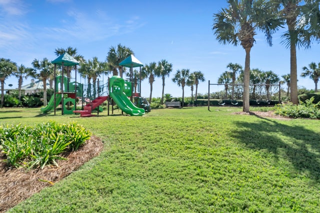 community playground featuring a lawn