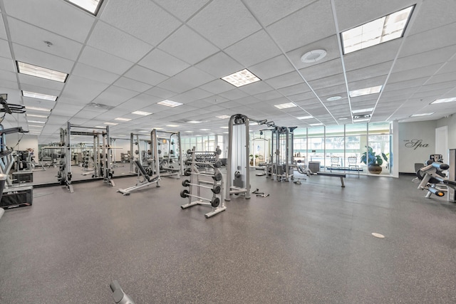 workout area featuring a paneled ceiling