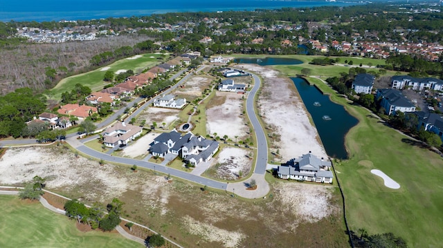 birds eye view of property with a residential view, view of golf course, and a water view