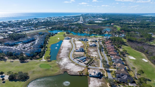 bird's eye view with a water view and view of golf course