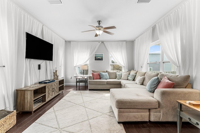 living room featuring ceiling fan and hardwood / wood-style floors