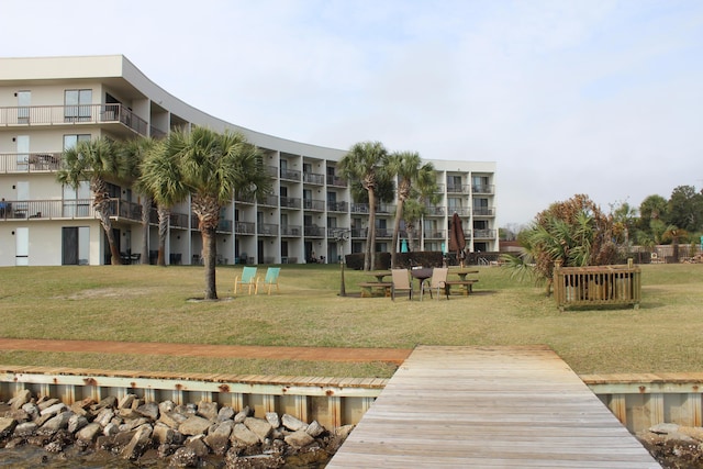 view of dock featuring a yard