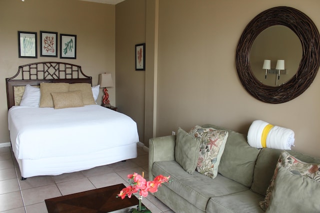 bedroom with light tile patterned floors