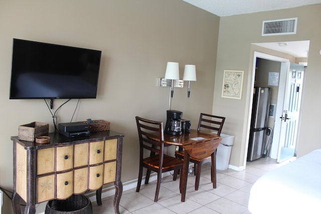 dining room with light tile patterned flooring