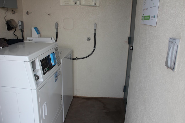 laundry room with washing machine and clothes dryer