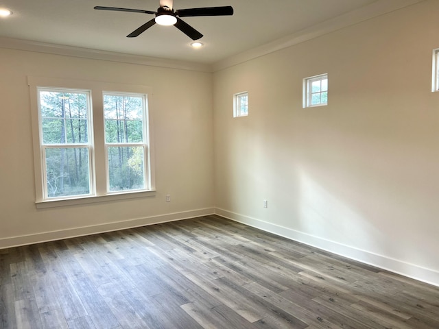 unfurnished room with baseboards, dark wood-type flooring, recessed lighting, and crown molding