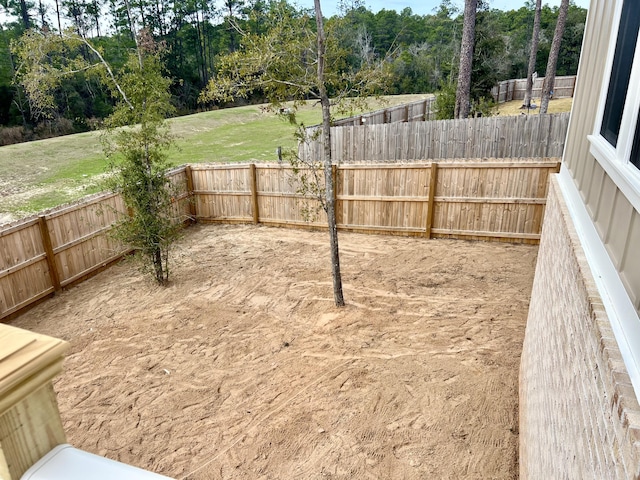 view of yard with a fenced backyard