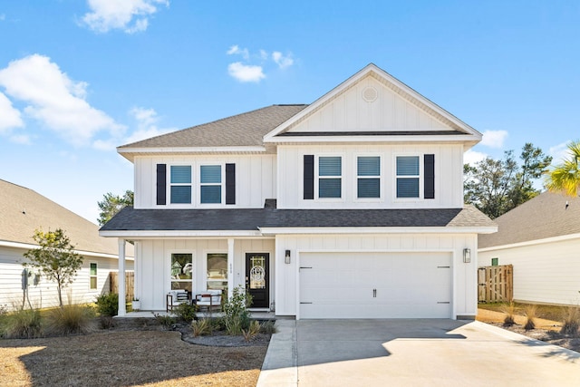 view of front of home with a garage and a porch