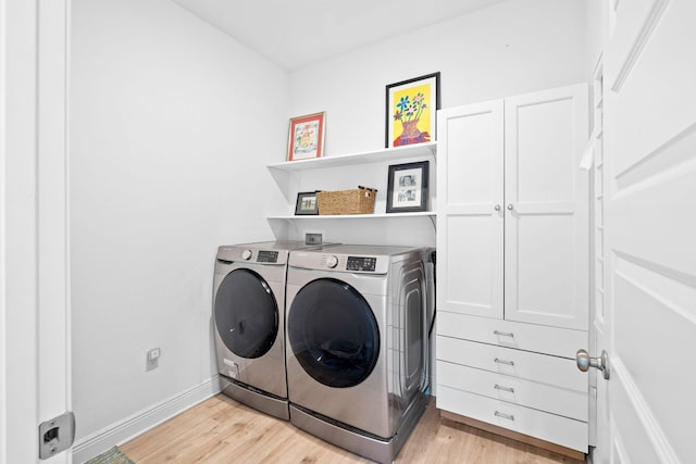 laundry area featuring independent washer and dryer and light wood-type flooring