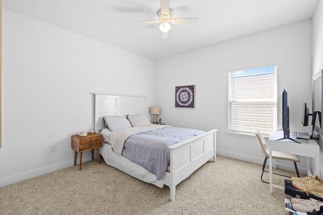 bedroom with light colored carpet and ceiling fan