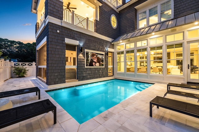 view of pool with a patio, fence, and a fenced in pool