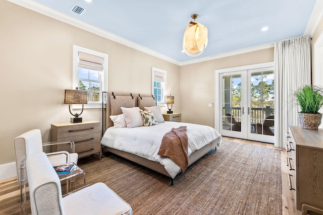 bedroom with hardwood / wood-style flooring, crown molding, access to outside, and french doors