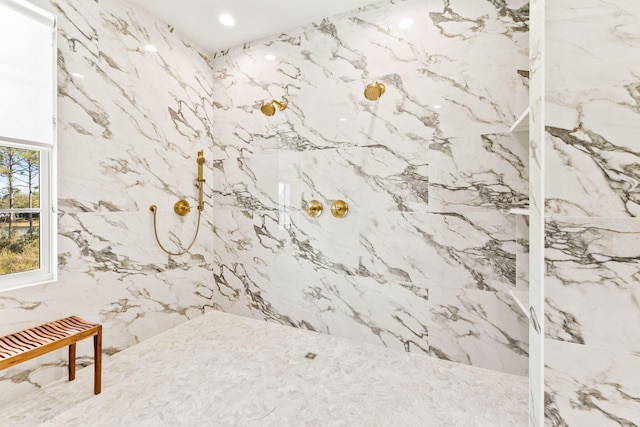 bathroom featuring tiled shower