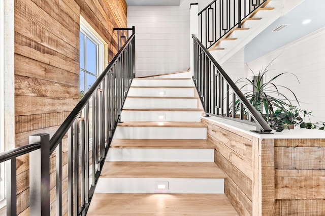 stairs with wood walls