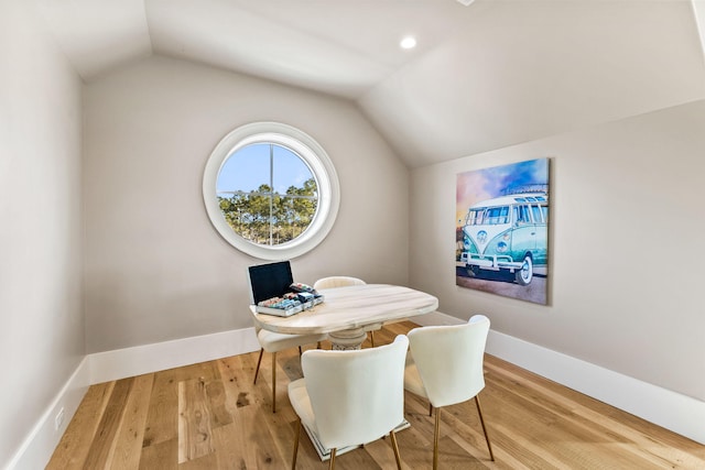 interior space with lofted ceiling and light hardwood / wood-style floors